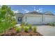 Two-car garage and charming front porch at 14705 Barefoot Ln, Parrish, FL 34219