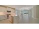 Modern kitchen with white cabinets and island at 14705 Barefoot Ln, Parrish, FL 34219