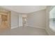 Bedroom with door to bathroom and view of another room at 14705 Barefoot Ln, Parrish, FL 34219
