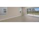 Bright dining room with sliding glass doors leading to a screened patio at 14705 Barefoot Ln, Parrish, FL 34219