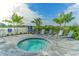 Relaxing spa with surrounding lounge chairs at 14705 Barefoot Ln, Parrish, FL 34219