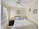 Bright bedroom with full bed, window blinds, and nightstand at 6157 Midnight Pass Rd # G11, Sarasota, FL 34242