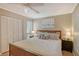 Bright bedroom with a queen bed, nightstands, and large closet at 6157 Midnight Pass Rd # G11, Sarasota, FL 34242