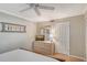 Bedroom with dresser, TV, and en-suite bathroom access at 6157 Midnight Pass Rd # G11, Sarasota, FL 34242