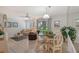 Bright dining area with table and chairs, adjacent to living room at 6157 Midnight Pass Rd # G11, Sarasota, FL 34242