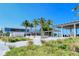 Modern beach pavilion with palm trees and seating at 6157 Midnight Pass Rd # G11, Sarasota, FL 34242