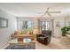Living room featuring comfortable seating and access to patio at 6157 Midnight Pass Rd # G11, Sarasota, FL 34242