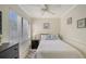 Cozy bedroom with a full bed and ceiling fan at 6157 Midnight Pass Rd # G11, Sarasota, FL 34242