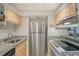 Kitchen features stainless steel appliances and granite countertops at 6157 Midnight Pass Rd # G11, Sarasota, FL 34242