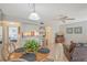 Dining area with round table and chairs, kitchen view at 6157 Midnight Pass Rd # G11, Sarasota, FL 34242
