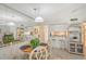 Dining area with kitchen pass-through and bar stools at 6157 Midnight Pass Rd # G11, Sarasota, FL 34242