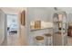 Small kitchen with granite countertop and bar stools at 6157 Midnight Pass Rd # G11, Sarasota, FL 34242