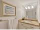 Bathroom boasts granite countertop, updated vanity, and large mirror at 6157 Midnight Pass Rd # G11, Sarasota, FL 34242