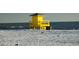 Yellow lifeguard stand on the beach at 6157 Midnight Pass Rd # G11, Sarasota, FL 34242