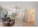 Living room with seating, view of dining and kitchen areas at 6157 Midnight Pass Rd # G11, Sarasota, FL 34242