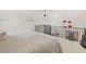 Loft bedroom overlooking the living room with access to a balcony at 6515 Mauna Loa Blvd, Sarasota, FL 34241