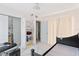 Bedroom with a double bed, built-in shelving, and a large closet at 6515 Mauna Loa Blvd, Sarasota, FL 34241