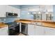 Modern kitchen with stainless steel appliances and wood countertops at 5412 11Th Street E Cir # 41, Bradenton, FL 34203