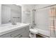 Clean bathroom with gray vanity, tub shower combo, and updated fixtures at 5412 11Th Street E Cir # 41, Bradenton, FL 34203
