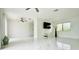 Bright living room with tile floors and sliding glass doors at 18875 Ashcroft Cir, Port Charlotte, FL 33948