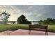 Serene backyard view featuring a lake and lush landscaping at 18875 Ashcroft Cir, Port Charlotte, FL 33948