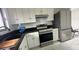 Modern kitchen with stainless steel appliances and granite countertops at 18875 Ashcroft Cir, Port Charlotte, FL 33948