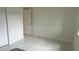 Bright bedroom with white walls, large closet, and tile floors at 18875 Ashcroft Cir, Port Charlotte, FL 33948