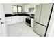 Modern kitchen with stainless steel appliances and granite countertops at 18875 Ashcroft Cir, Port Charlotte, FL 33948