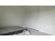Bedroom with white walls, large closet, and tile floors at 18875 Ashcroft Cir, Port Charlotte, FL 33948