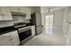 Modern kitchen with stainless steel appliances and granite countertops at 18875 Ashcroft Cir, Port Charlotte, FL 33948