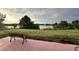 Peaceful backyard oasis with a lake view and grassy area at 18875 Ashcroft Cir, Port Charlotte, FL 33948