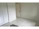 Bright bedroom with white walls, large closet, and tile floors at 18875 Ashcroft Cir, Port Charlotte, FL 33948