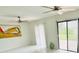 Sunlit living room with large windows and sliding glass doors at 18875 Ashcroft Cir, Port Charlotte, FL 33948