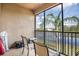 Cozy balcony with seating overlooking a serene water view at 1003 Fairwaycove Ln # 205, Bradenton, FL 34212