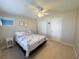 Cozy bedroom with a comfortable bed and well-lit lighting at 2425 Flamingo Blvd # K28, Bradenton, FL 34207