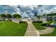 Beautiful community pool area surrounded by lush greenery and well-maintained walkways at 2425 Flamingo Blvd # K28, Bradenton, FL 34207