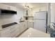 Bright kitchen featuring modern appliances, white cabinets, and an eye-catching countertop at 2425 Flamingo Blvd # K28, Bradenton, FL 34207