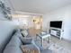 Bright living room features a comfortable couch with a modern table set at 2425 Flamingo Blvd # K28, Bradenton, FL 34207