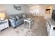 Comfortable living room featuring a plush sofa and modern furnishings at 2425 Flamingo Blvd # K28, Bradenton, FL 34207