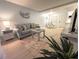 Inviting living room featuring a plush sofa and coastal decor at 2425 Flamingo Blvd # K28, Bradenton, FL 34207