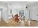 Dining area featuring a charming chandelier, hardwood floors, and built-in cabinets at 3125 Pickett St, Port Charlotte, FL 33981