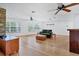Spacious living room featuring hardwood floors, recessed lighting, and large window views at 3125 Pickett St, Port Charlotte, FL 33981