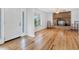 Inviting living room with gleaming hardwood floors, a brick fireplace, and ample natural light at 3125 Pickett St, Port Charlotte, FL 33981