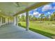 Spacious porch with white columns is perfect for enjoying the serene views at 3125 Pickett St, Port Charlotte, FL 33981