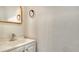 Clean bathroom featuring a white vanity and a gold framed mirror at 3339 Ramblewood Ct, Sarasota, FL 34237