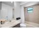 Bright bathroom with tiled walls and a shower-tub combination at 4175 Arrow Ln, Sarasota, FL 34232
