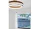 Bedroom with a statement light fixture and view of the yard at 4175 Arrow Ln, Sarasota, FL 34232