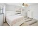 Bright bedroom with natural light, a queen size bed, and a decorative rug, creating a cozy and inviting space at 4175 Arrow Ln, Sarasota, FL 34232