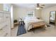 Comfortable bedroom features neutral walls, ceiling fan, and a stylish bench at 4175 Arrow Ln, Sarasota, FL 34232