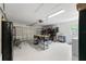 Spacious garage featuring epoxy flooring, work table, and ample storage space, providing a functional area at 4175 Arrow Ln, Sarasota, FL 34232